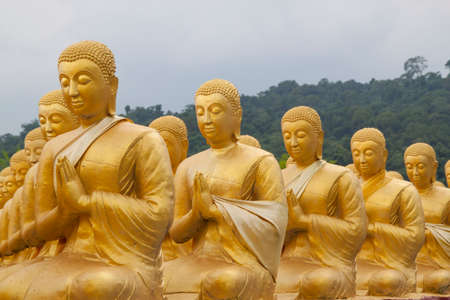 Golden disciple statues in the rowの写真素材