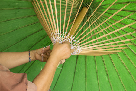 A process in umbrella production in Bo Sang, Chiangmai, Thailandの写真素材