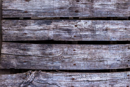 Old, gray boards fastened with rusty nails.の写真素材