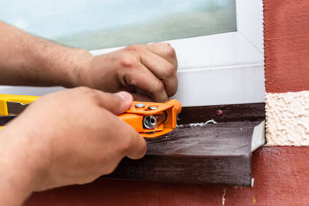 Construction work - installation of rivets. Window tint repair. Plastic windows.