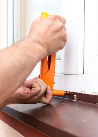 Construction work - installation of rivets. Window tint repair. Plastic windows.