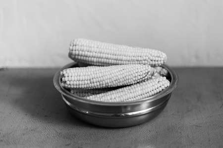 Boiled corn in a steel bowl