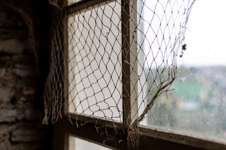 Fishing net on the windowの写真素材
