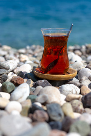 Armudu. Tea in a glass on the beach.の写真素材