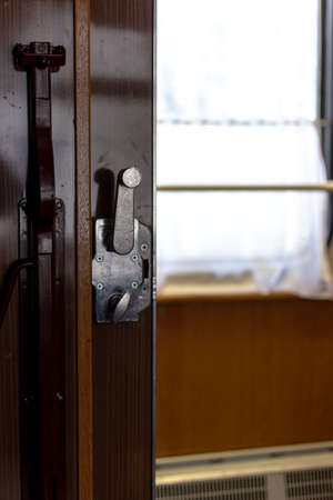 Door and doorknob in a train compartment. Travel by train.の写真素材