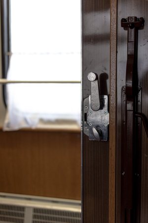 Door and doorknob in a train compartment. Travel by train.の写真素材