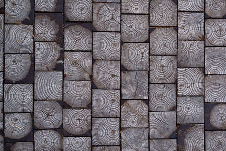 Background from gray wooden squares stacked togetherの写真素材