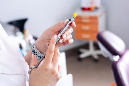 Female hands with a syringe for injection. Vaccination.の写真素材