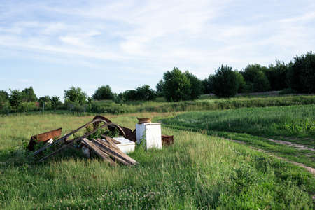 Dump of old technology in nature. Scrap metal.の写真素材