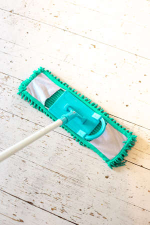 With my mop on the white wood floor