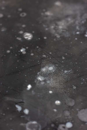 Gray wall with spots of paint. Decorative background.