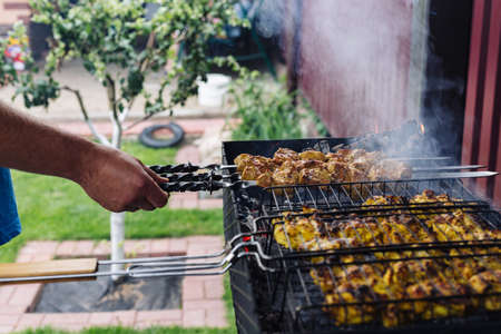 Chicken kebab is cooked on the grill. High quality photoの写真素材