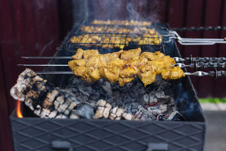 Pork kebab on skewers is fried on the grill