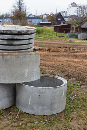 Concrete well rings and slabs at construction siteの写真素材