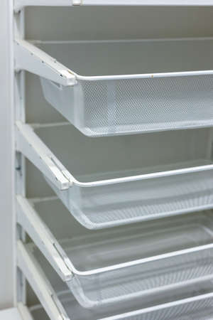 White Mesh Metal Shelves for Closet Storageの写真素材