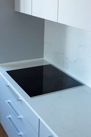 Induction cooker in modern kitchen at homeの写真素材