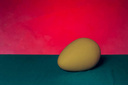 Egg on a bicolor background. Easter egg.の写真素材