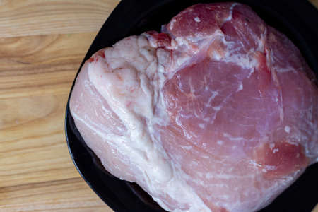 Pork tenderloin on a plate. Fresh meet.の写真素材