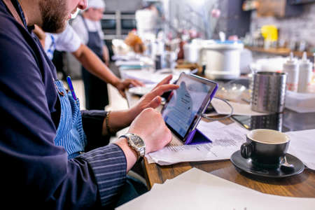 Chef reviews the recipe of cooking dishes. Master class in the kitchen. The process of cooking. Step...