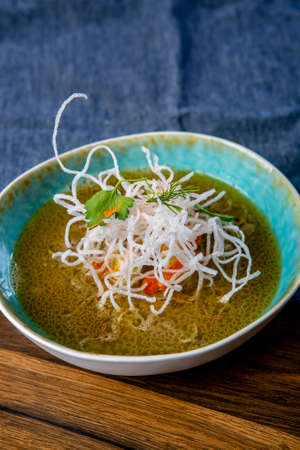 Soup Fo Bo from smoked catfish with cellophane noodles. The work of a professional chef. Dish from a...