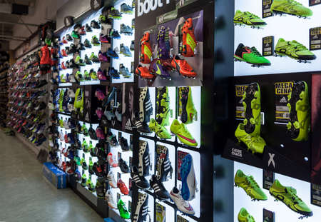 LJUBLJANA, SLOVENIA - SEPTEMBER 18, 2015: Photo shows a soccer shoes display wall at the SPORT 2000 store. In the picture are mainly shown the Adidas, Puma and Nike examples.のeditorial素材