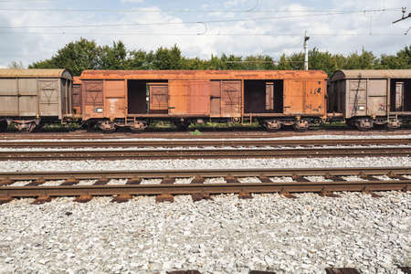 old and empty freight wagons waiting on the stationの写真素材