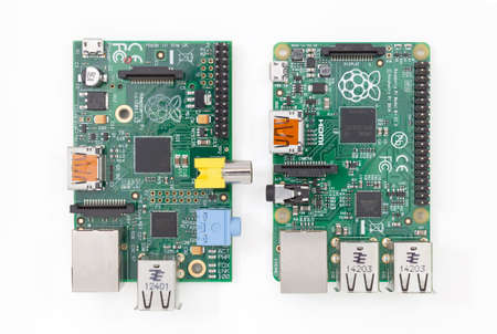 Ljubljana, Slovenia - January 1, 2015: Raspberry Pi version B on the left and new version B on the right. New model has 4 USB ports, more memory, larger GPIO connector and some other improvements.のeditorial素材