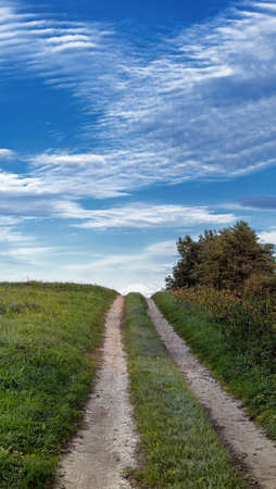 countryside path with nice cloudscapeの写真素材