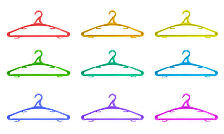 Plastic hangers of various colours over white backgroundの写真素材