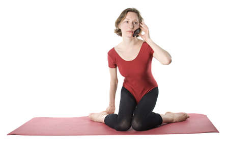 Exercising woman talking on cellphone, studio shot