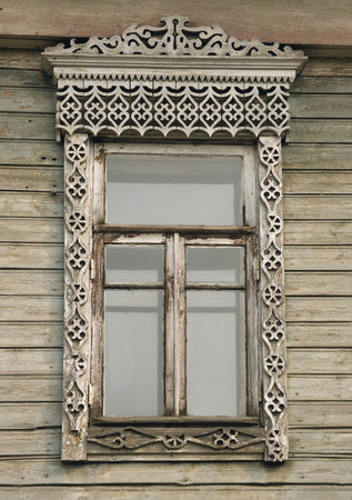 Window of an old russian house decorated with carvingの写真素材