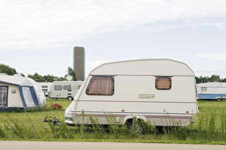 White trailer standing in a camping
