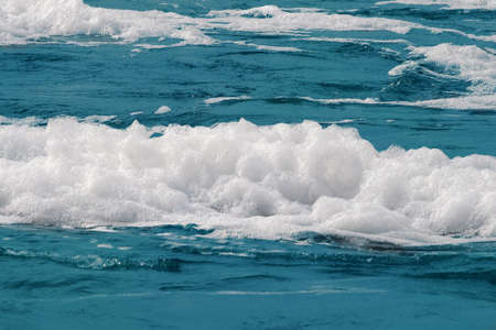 White foam on a sea water surface