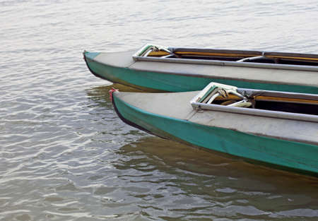 Two canoes on still water of a lakeの写真素材