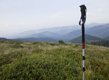 Alpenstock with the background of Carpathian valley and mountainsの写真素材