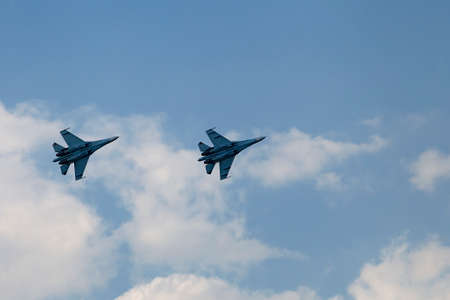 Planes on an air show against cloudy sky