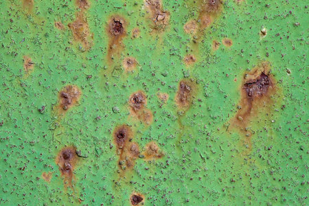 Close-up of peeling paint and rust on a wallの写真素材