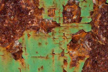 Close-up of peeling paint and rust on a wallの写真素材