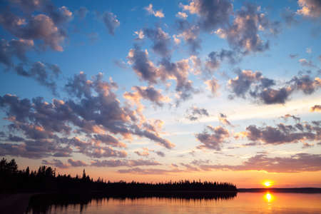 Sunset on a lake on the Kola peninsula, Northern Russiaの写真素材
