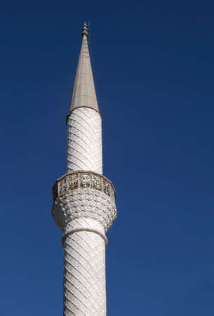 Minaret against clear blue sky, view from belowの写真素材