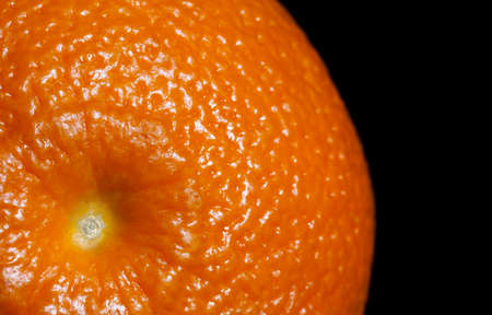 Close-up of an orange on black backgroundの写真素材