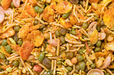 Dry roasted Indian snack mix, close-up backgroundの写真素材