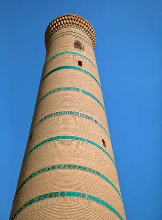 Minaret of a mosque in Uzbeki style, view from belowの写真素材