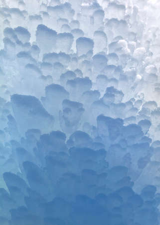 Block of blue smooth melting ice, close-up
