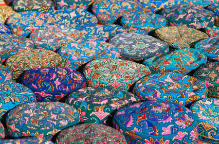 The traditional Uzbek cap, named tubeteika, or kalpoq, decorated with embroidery. Bukhara, Uzbekistanの写真素材