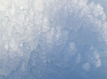 Block of blue smooth melting ice, close-up