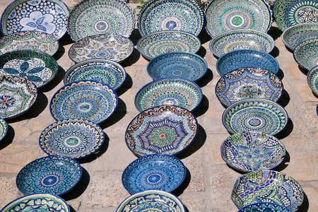 Traditional ceramic dishware in a street market, Uzbekistanの写真素材