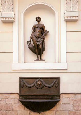 Statue in a wall niche in Rigaの写真素材