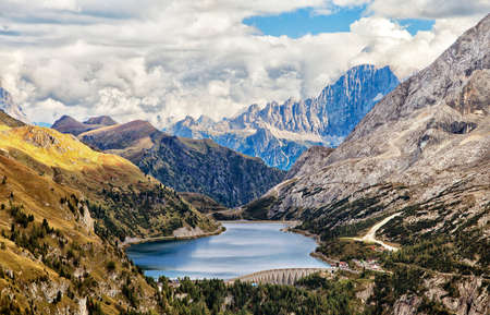 Fedaia lake in Dolomites with view of Marmolada mountainの写真素材
