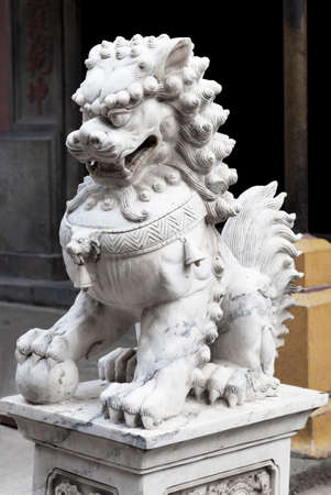 Chinese lion at the entrance of a templeの写真素材
